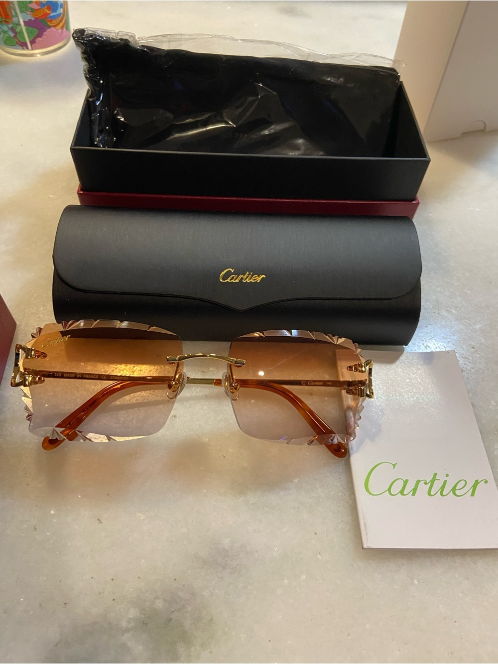 Cartier Rimless Sunglasses in Gold with Amber/Brown Lenses